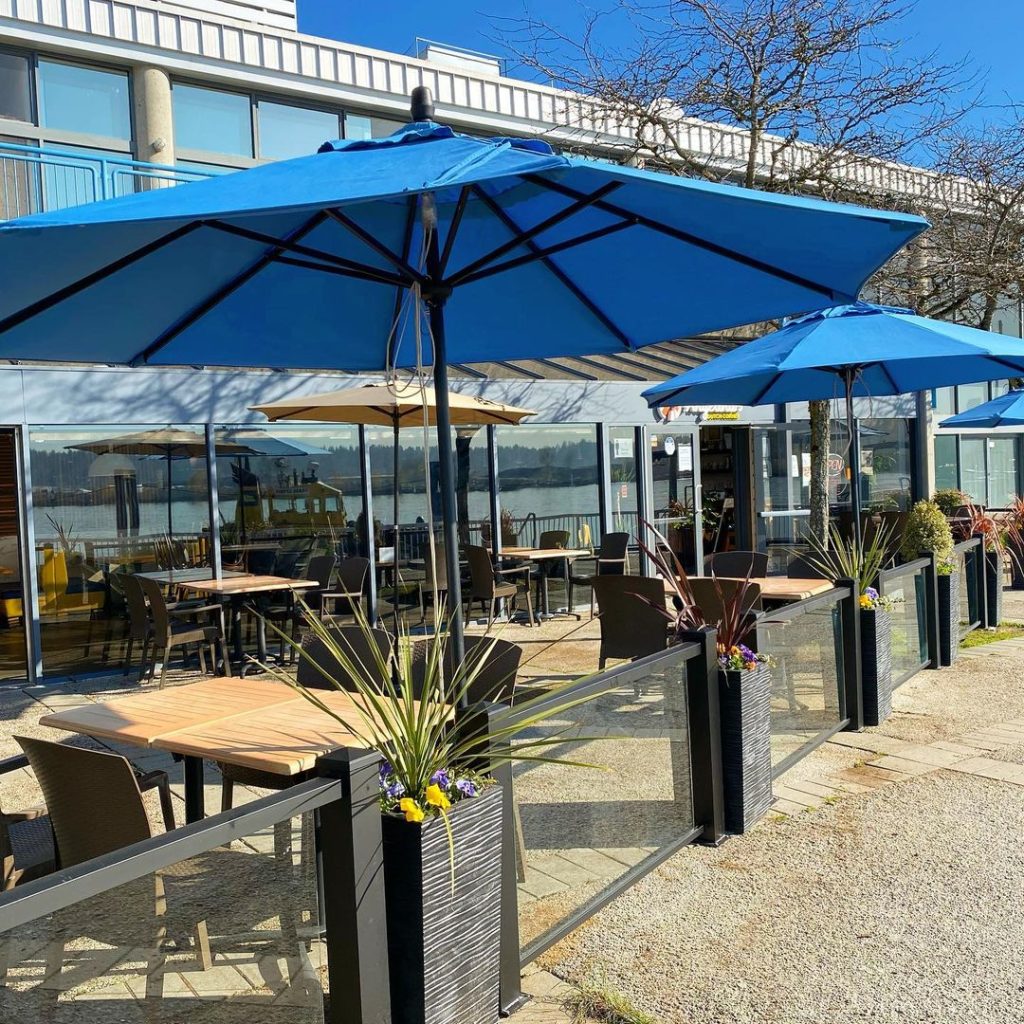 An outdoor patio with blue umbrellas